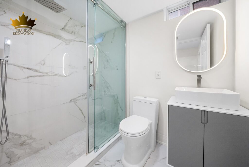 bathroom with white theme renovation by Shahkar renovation compay